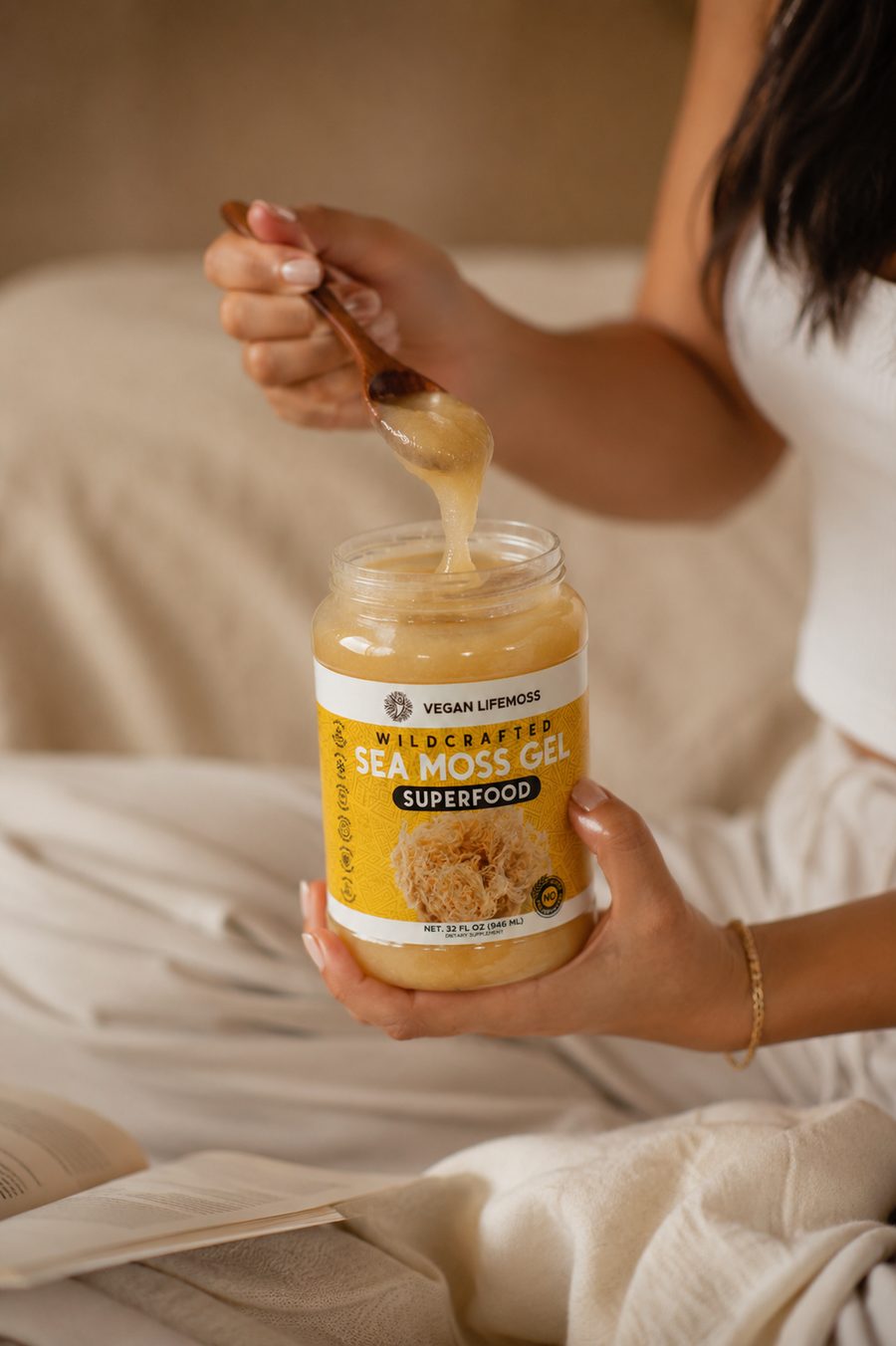 A spoon of Sea Moss Gold Gel lifted from the jar